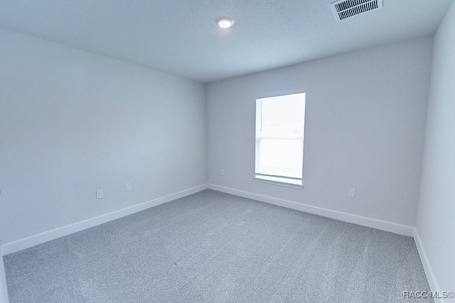 unfurnished room with carpet