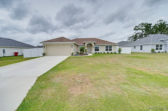 single story home featuring a garage and a front lawn