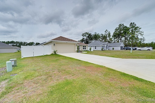 ranch-style house with a garage and a front lawn