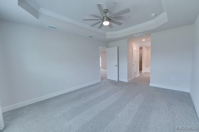 8330 N India Way, Citrus Springs, FL 34434 - spare room featuring a raised ceiling, ornamental molding, a ceiling fan, carpet, and baseboards