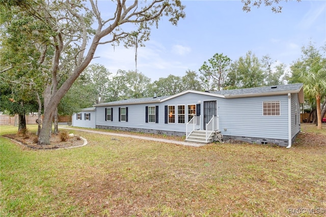 manufactured / mobile home with a front lawn