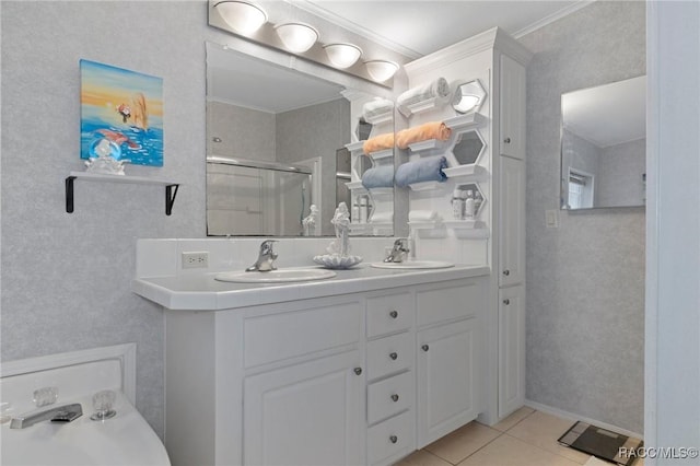 bathroom featuring ornamental molding, walk in shower, tile patterned flooring, and vanity