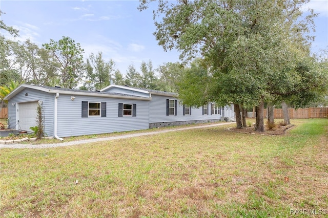 exterior space with a front yard and a garage