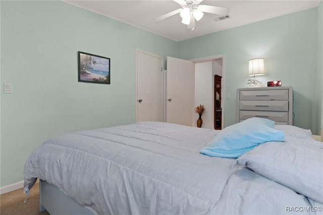 carpeted bedroom featuring ceiling fan