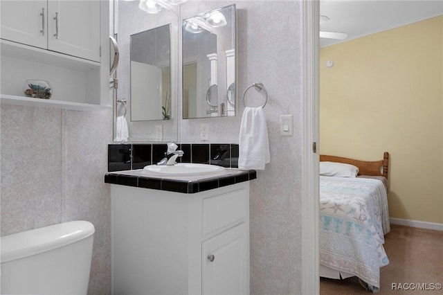 bathroom with vanity and toilet