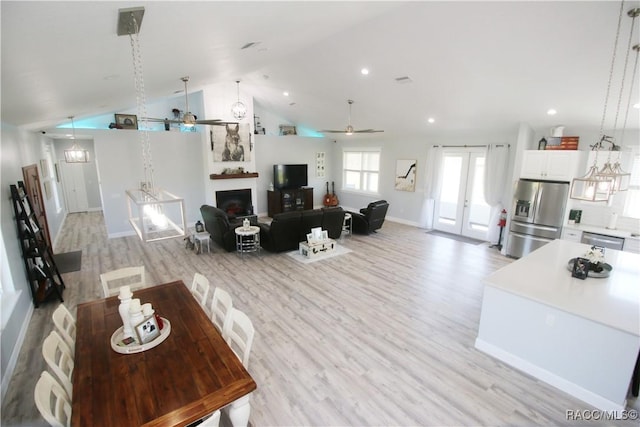 living room featuring recessed lighting, a fireplace, light wood-type flooring, and a ceiling fan