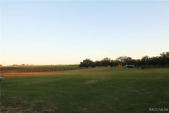 view of community featuring a yard and a rural view