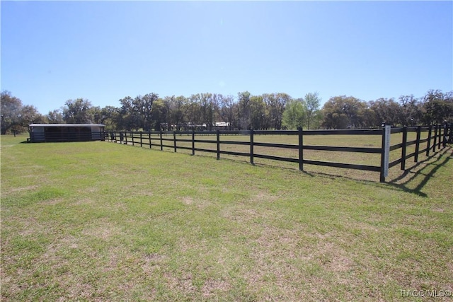 view of yard with a rural view