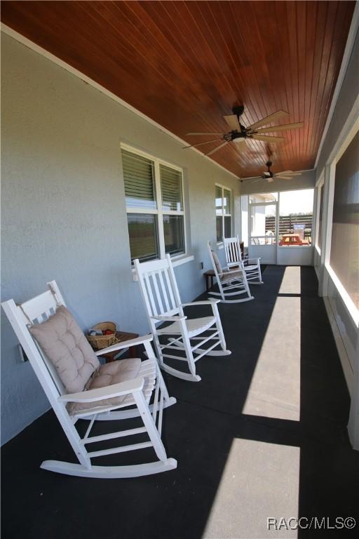 view of patio / terrace featuring a porch and a ceiling fan