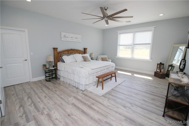 bedroom with visible vents, recessed lighting, wood finished floors, and baseboards