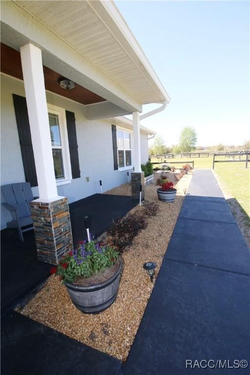 view of side of home featuring stucco siding