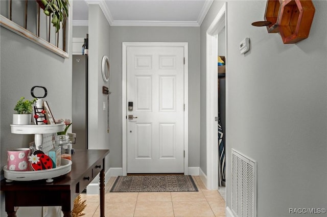 tiled entryway with ornamental molding