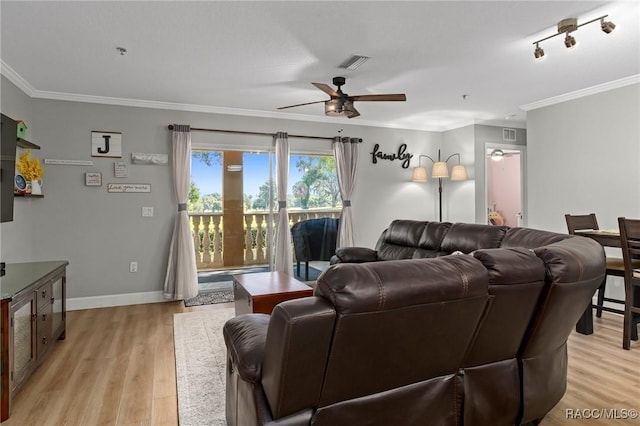 living room with crown molding, ceiling fan, and light wood-type flooring