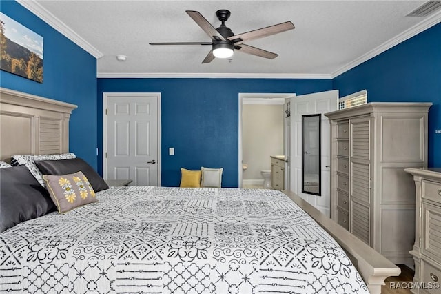 bedroom with crown molding, ceiling fan, ensuite bath, and a textured ceiling