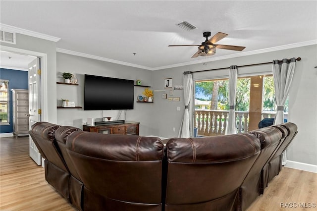 living room featuring crown molding, ceiling fan, and light wood-type flooring