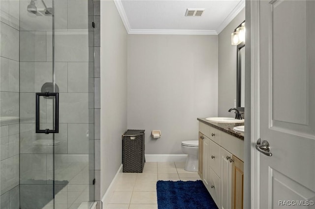 bathroom with vanity, tile patterned floors, ornamental molding, and toilet