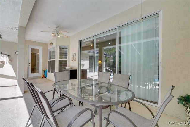 sunroom featuring ceiling fan