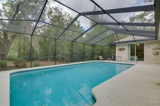 view of pool featuring a lanai and a patio