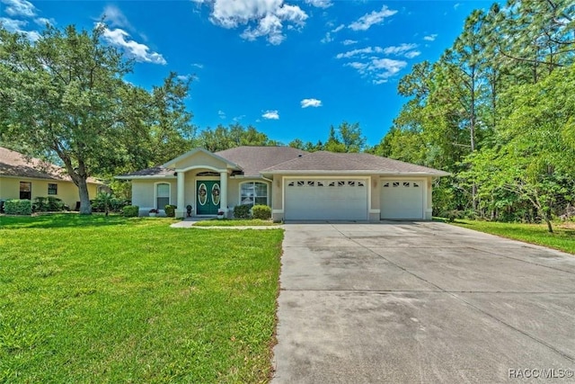 ranch-style home with a garage and a front yard