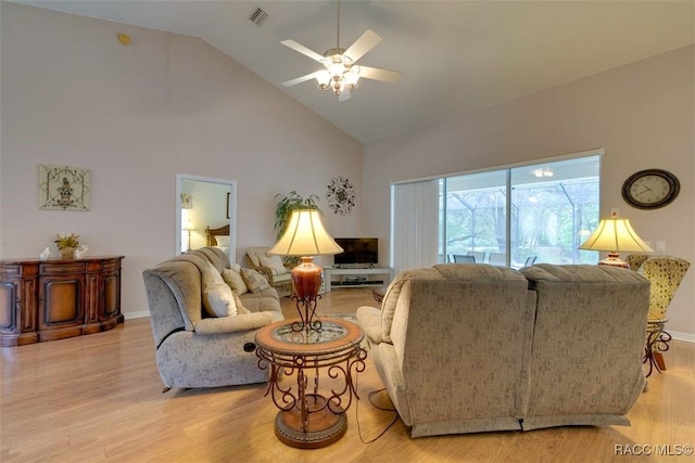 living room featuring ceiling fan, high vaulted ceiling, and light hardwood / wood-style floors