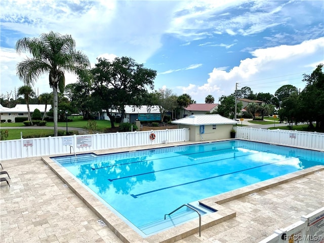 view of swimming pool featuring a patio area