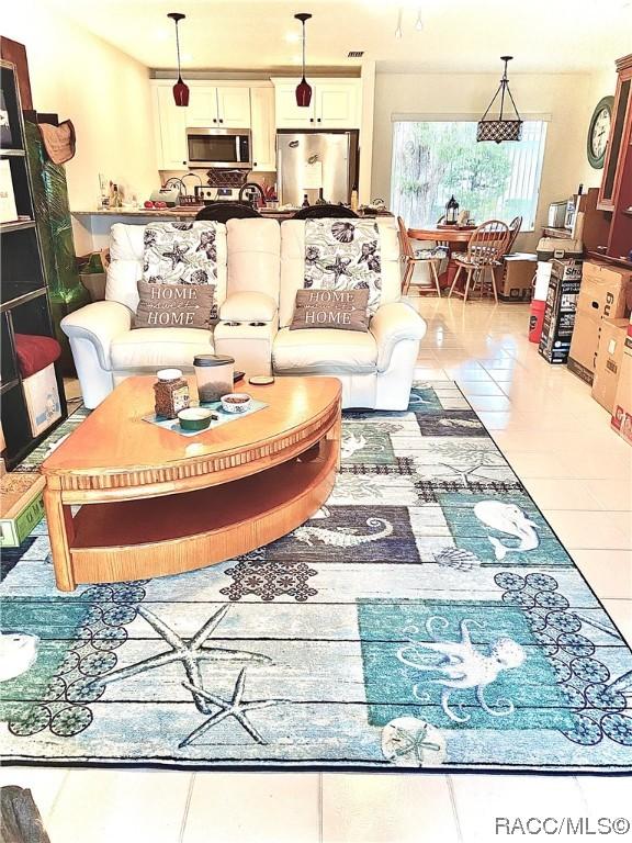 living room with light tile patterned floors