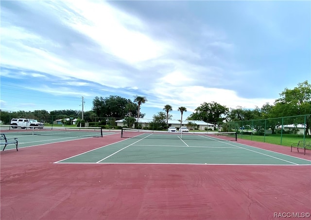 view of sport court featuring basketball hoop