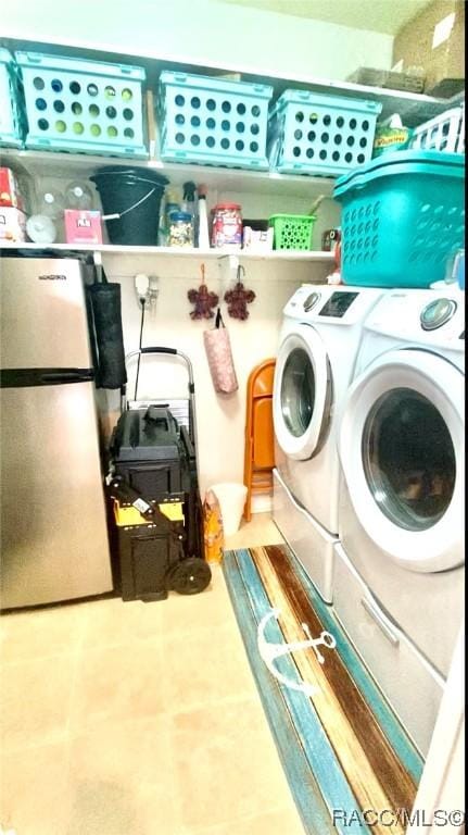 laundry room featuring washing machine and dryer