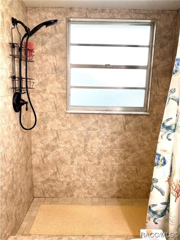 bathroom with a shower with shower curtain