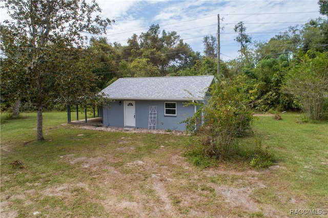 exterior space with an outbuilding