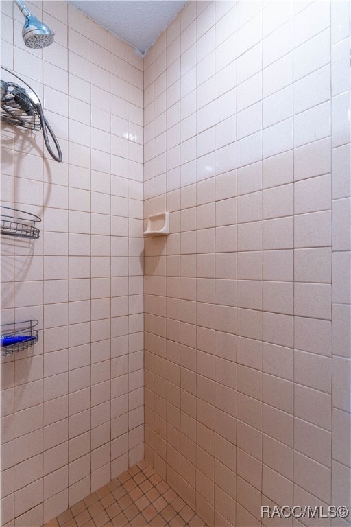 bathroom with tiled shower