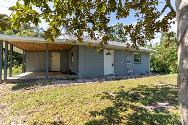 single story home featuring a patio and a front yard