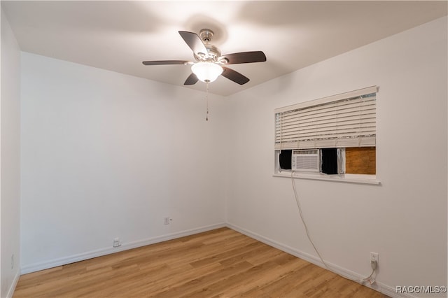 unfurnished room with ceiling fan and light wood-type flooring