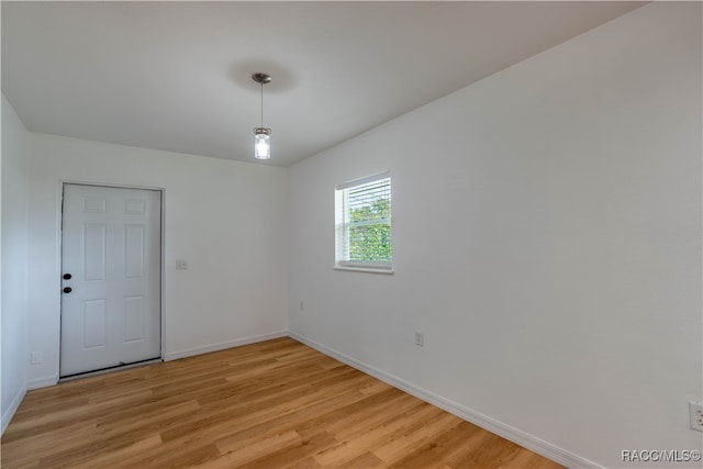 spare room featuring light hardwood / wood-style floors