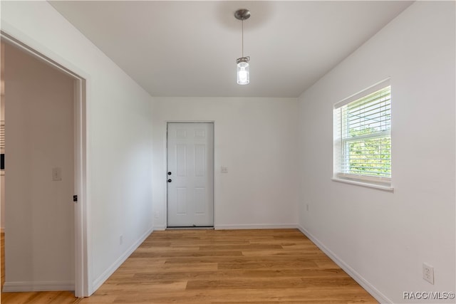 spare room featuring light wood-type flooring