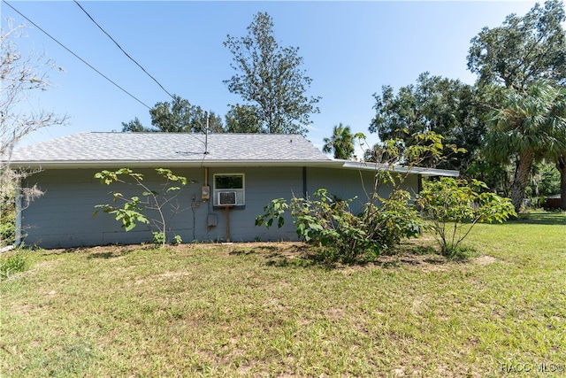 view of home's exterior with a lawn and cooling unit