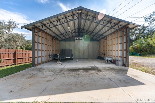 view of parking / parking lot featuring a carport