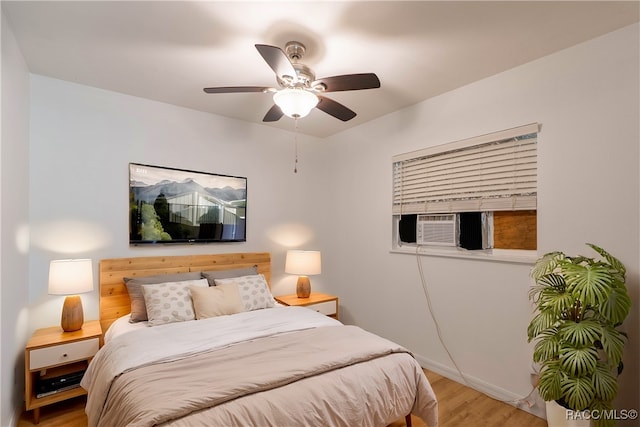 bedroom featuring light hardwood / wood-style floors and ceiling fan