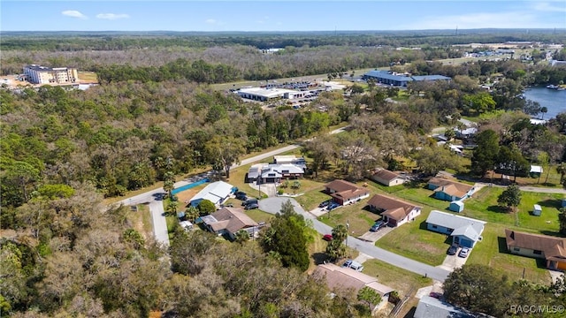 bird's eye view featuring a wooded view