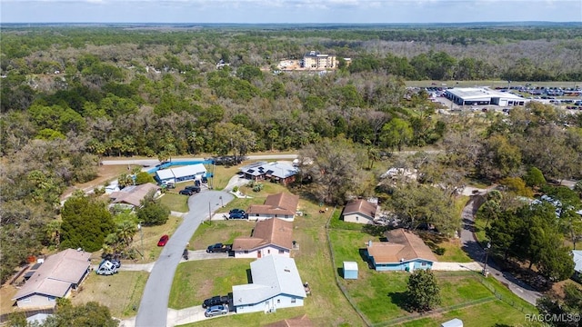 bird's eye view featuring a residential view and a forest view