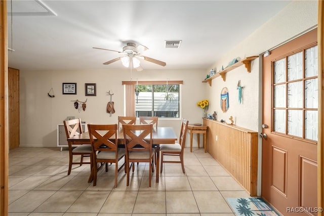 dining space featuring light tile patterned floors, visible vents, and ceiling fan