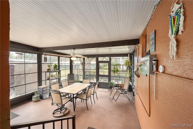 sunroom / solarium with beamed ceiling