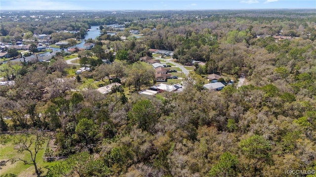 birds eye view of property with a view of trees and a residential view