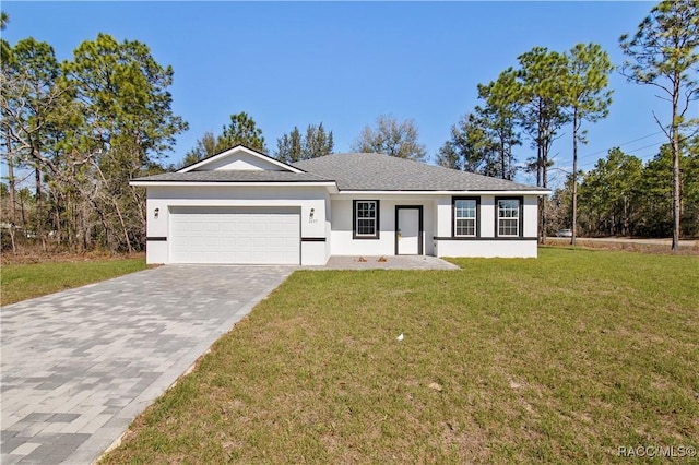 ranch-style home featuring a front lawn, decorative driveway, an attached garage, and stucco siding