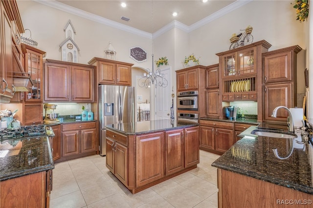 1993 N Eagle Chase Dr, Hernando, FL 34442 - kitchen featuring a sink, decorative backsplash, brown cabinetry, and stainless steel appliances