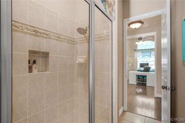 1993 N Eagle Chase Dr, Hernando, FL 34442 - bathroom with a ceiling fan, tile patterned flooring, and a stall shower