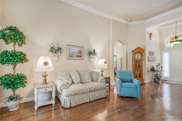 1993 N Eagle Chase Dr, Hernando, FL 34442 - living area with crown molding, arched walkways, baseboards, and hardwood / wood-style flooring