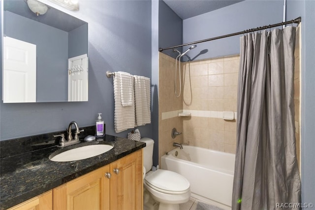 full bathroom featuring shower / bath combination with curtain, vanity, and toilet