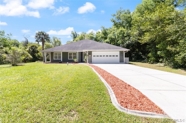 ranch-style home featuring a front lawn and a garage