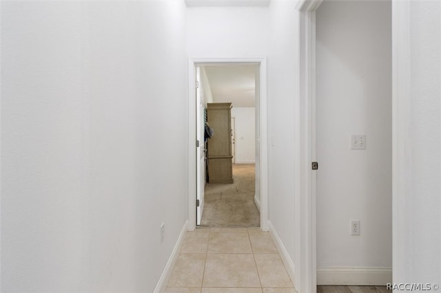 hallway featuring light tile patterned flooring